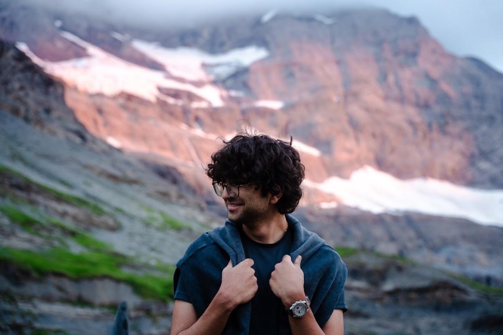 Iyad Mallah in front of an alpine glacier at dusk